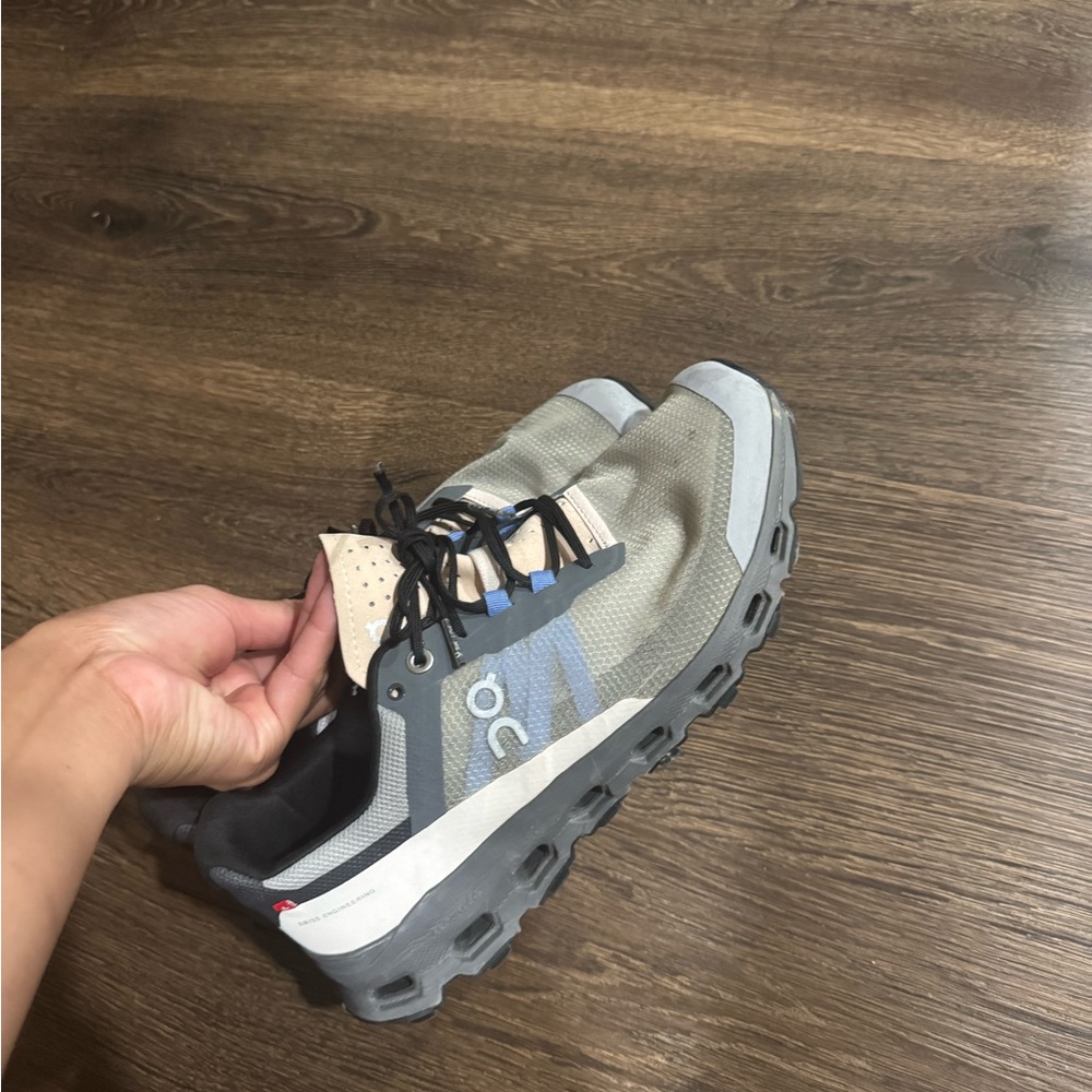 On Running Gray and White Athletic Shoes